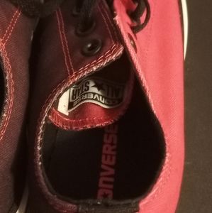 Converse half red half black shoes.